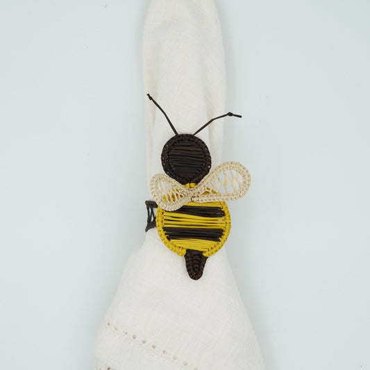 Overhead view of woven bee napkin ring.