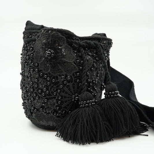 Black embroidered and beaded mochila purse.
