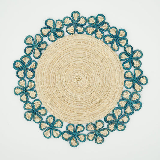 Overhead view of woven blue flower border placemat.