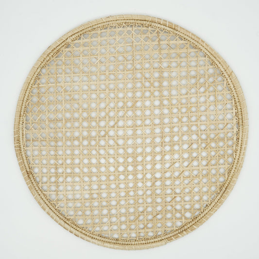 Overhead view of woven cane pattern placemat.