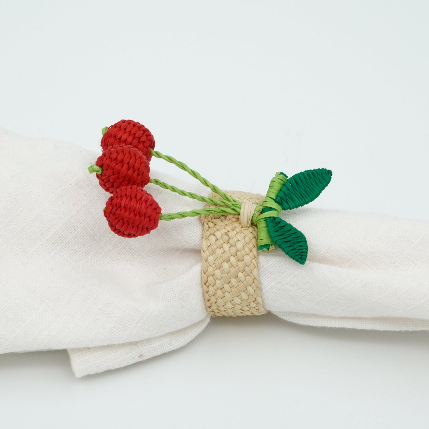 Side view of woven cherry napkin rings.