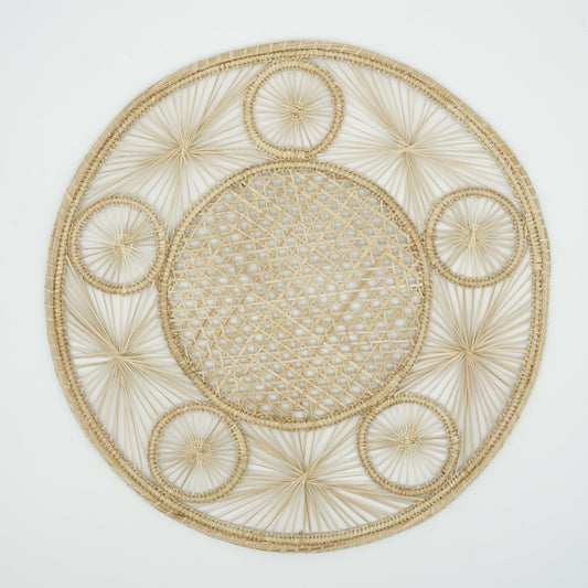 Overhead view of woven circle border placemat.
