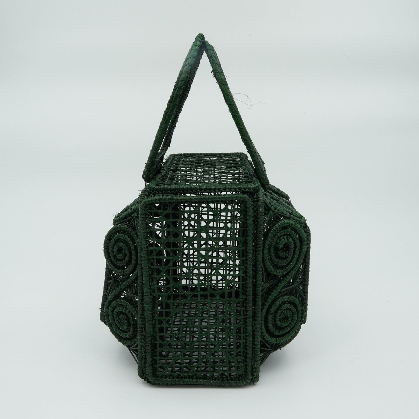 Direct view of woven green lunchbox purse.