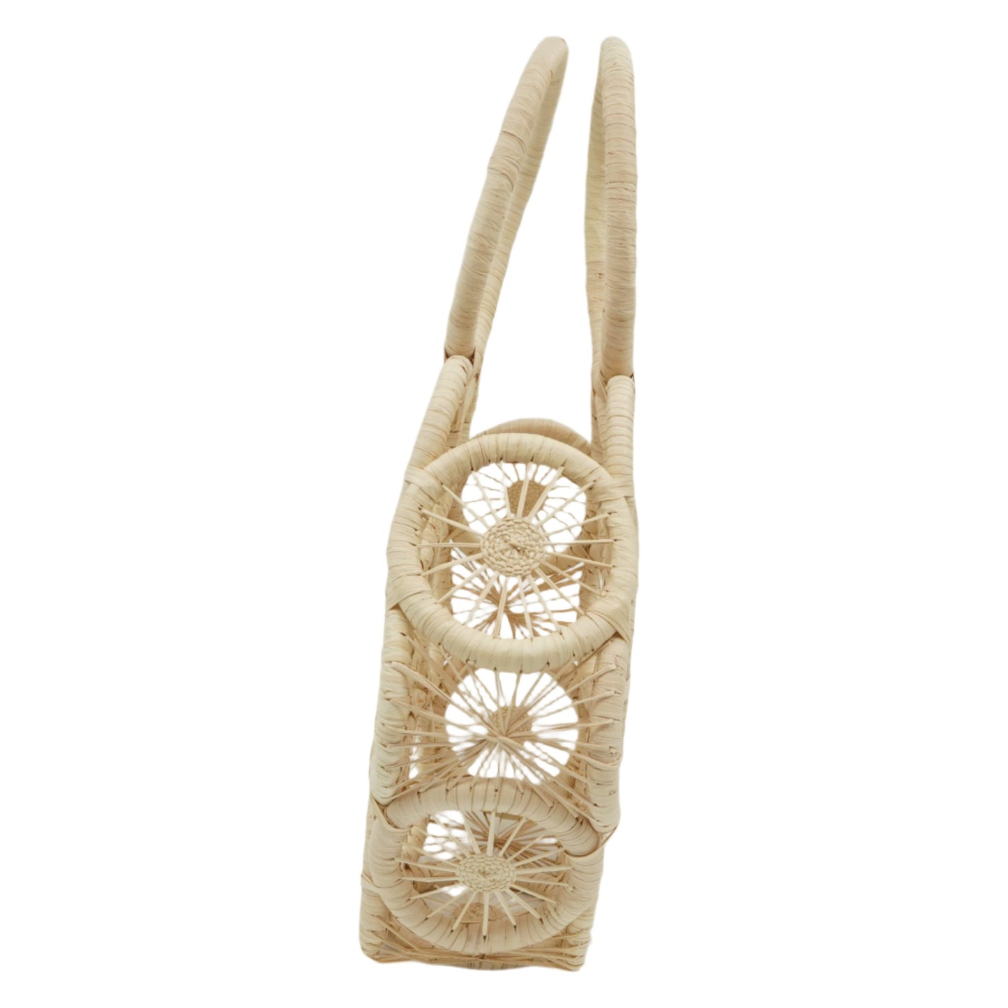 Side view of woven hexagon purse with circle pattern.