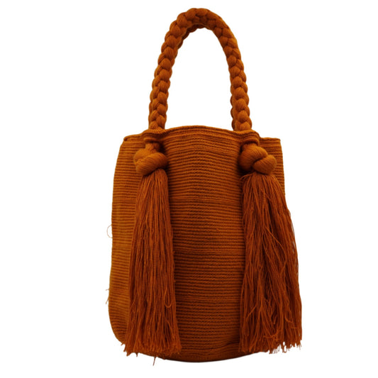 Large orange mochila woven handbag with tassels.