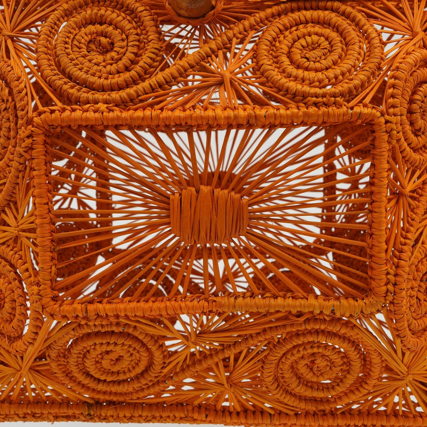 Close up view of woven mustard lunchbox purse.