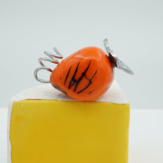 Orange tagua cheese mouse with pewter face and tail.