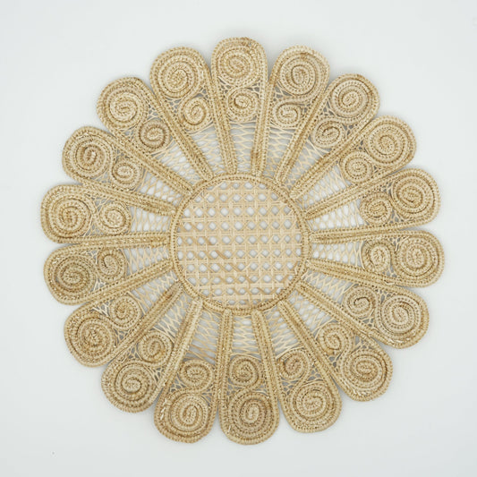 Overhead view of woven peacock placemat.