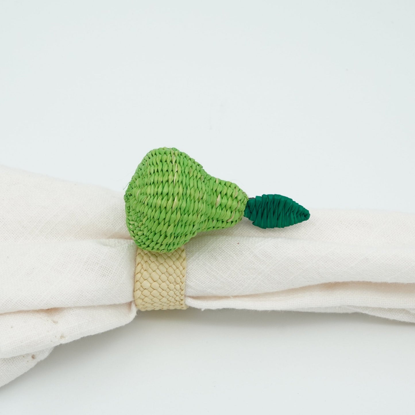 Side view of woven pear napkin ring.