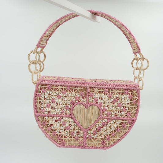 Back view of woven pink carriel heart purse.