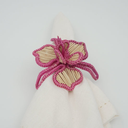 Head on view of woven pink orchid napkin ring.