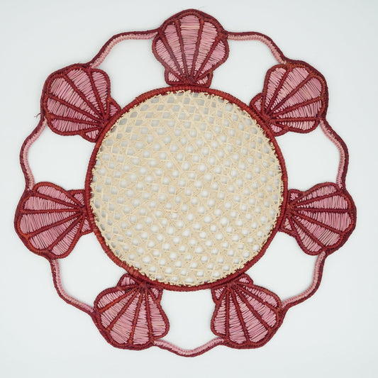 Overhead view of woven seashell border placemat.