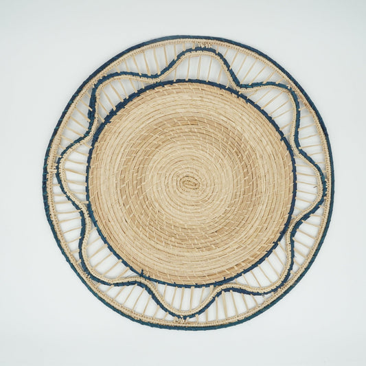 Overhead view of blue woven small wave border placemat.