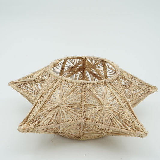 Head on view of woven star candle holder.