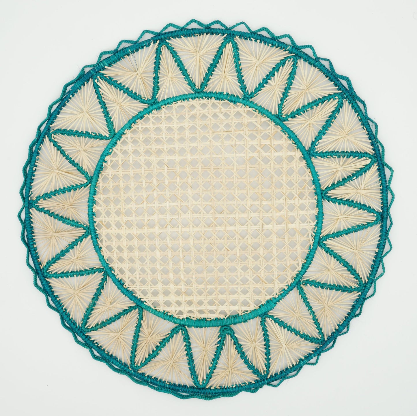 Overhead view of blue woven triangle border placemat.