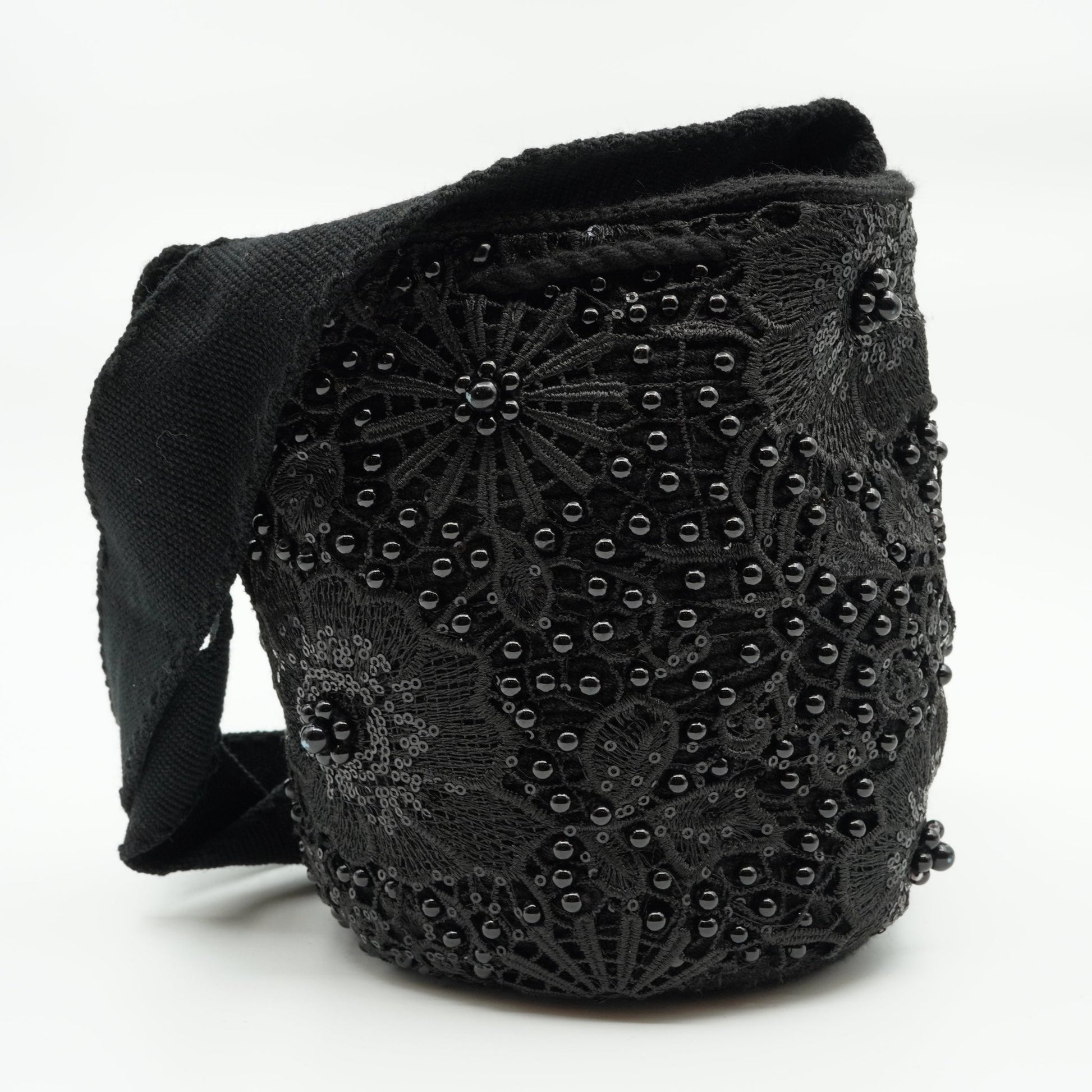 Black embroidered and beaded mochila purse.