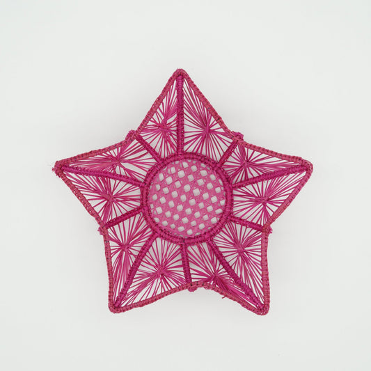 Overhead view of woven pink starfish basket.