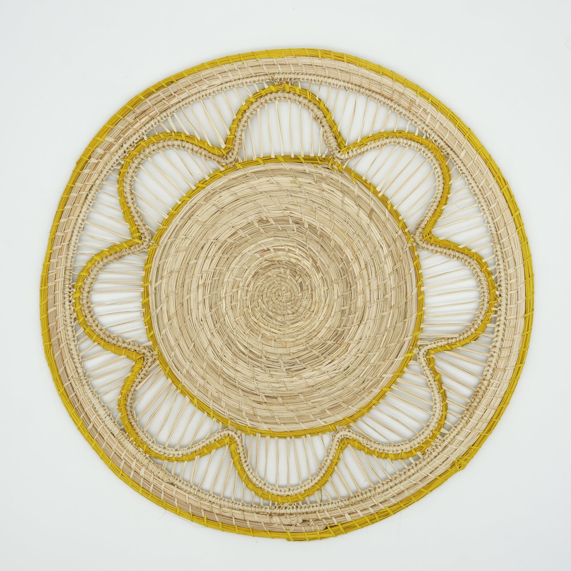 Overhead view of yellow woven small wave border placemat.