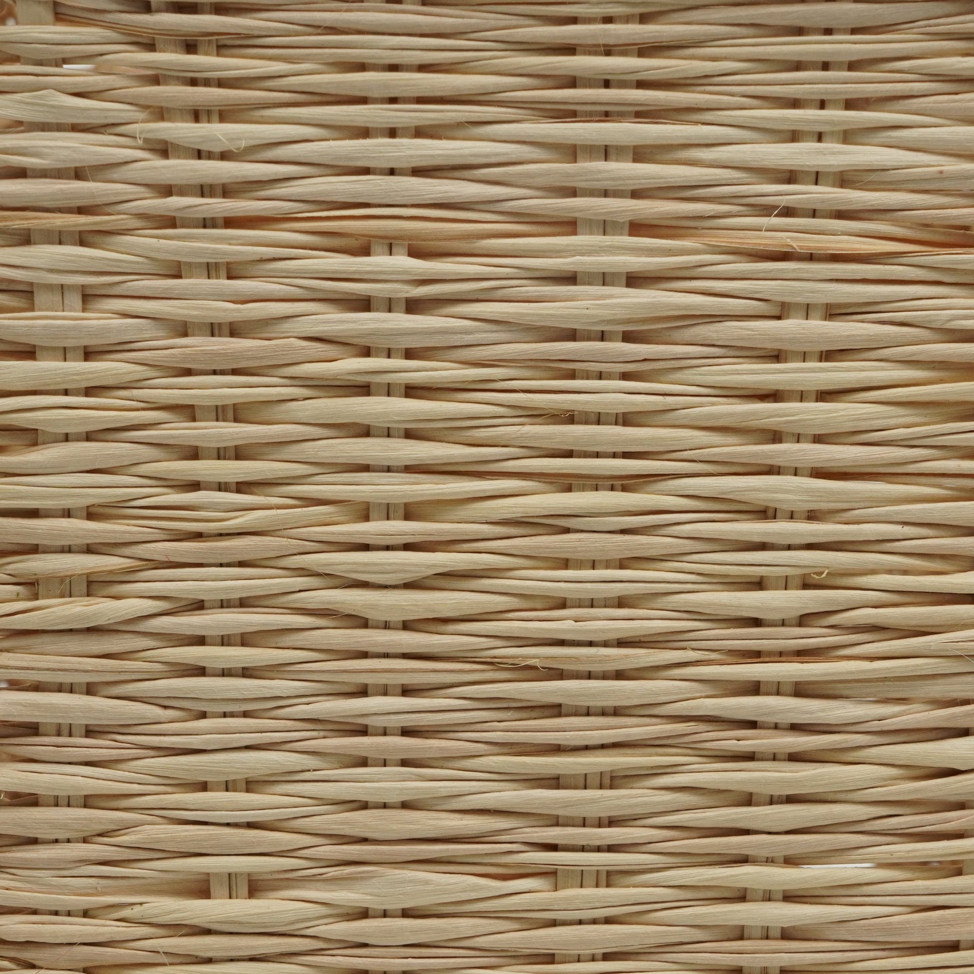Close up view of solid square woven wine basket.